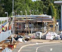 Cladding material being lifted onto the roof of the new station building at Alloa on 4 October 2007, view east from the station car park.<br><br>[John Furnevel 04/10/2007]