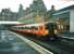 318261 stands at Ayr platform 1 in April 1998 just about to leave with a service for Glasgow Central.<br><br>[David Panton /04/1998]