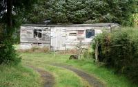 A long - grounded coach, presumably once a resident of the old goods yard, lies in what is now a back garden at Kippen on 11 October. I suspect the absence of a <I>Not to be moved</I> plate is nonetheless still in contravention of current Health & Safety regulations.<br><br>[John Furnevel 11/10/2007]