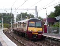 320307 brings a Helensburgh train into Carntyne on 16 September.<br><br>[David Panton 16/09/2007]
