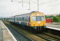 Experimental liveried 101 692 with a Cumbernauld - Motherwell service at Coatbridge Central in July 1997.<br><br>[David Panton /07/1997]