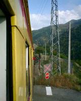 <B>LittleYellow</B> Train. Crossing the N116 Perpignan to Andorra road.<br><br>[Alistair MacKenzie 16/10/2007]