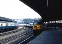 A class 50 arrives at Bristol Temple Meads with a train from the west country in May 1985. A Portsmouth - Cardiff train stands at the platform opposite.<br><br>[John McIntyre /05/1985]