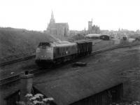 Class 24 leaving Fraserburgh with 2 fish vans on a Saturday morning goods to Aberdeen in July 1971.<br><br>[John Williamson 10/07/1971]