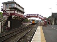 Service for Carlisle stops at the staggered westbound platform at Haltwhistle on 15 October 2006.<br><br>[John McIntyre 15/10/2006]