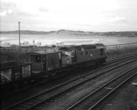 A class 26 shunts the daily goods from Aberdeen, Craiginches into the yard at Fraserburgh, on a fine day in the late spring of 1972. (The guard obviously enjoyed having his photograph taken).<br><br>[John Williamson /05/1972]