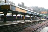 The partially refurbished canopy over the west end of platforms 18 and 19 at Waverley standing in the rain on 8 January 2008 and showing some of the work carried out to date. In the centre background the Church of Scotland General Assembly building overlooks the scene from the top of The Mound. <br><br>[John Furnevel 08/01/2008]