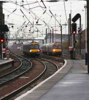 Trains for Waverley on the Glasgow and Forth Bridge lines run in parallel under the spaghetti approaching Haymarket at the start of the snow shower on 8 January 2008.  <br><br>[John Furnevel 08/01/2008]