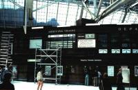The old manual train information display board at Glasgow Central station seen from the main concourse in May 1985.<br><br>[David Panton /05/1985]