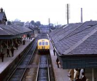 A Waverley bound Metro-Cammell DMU runs past the stations west box and into the eastbound platform at Falkirk Grahamston in 1970. <br><br>[John McIntyre //1970]