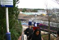 View over Livingston North on 28 January showing the extensive work currently taking place on the south side of the station. Meantime, passengers who have just alighted from a Waverley - Bathgate service climb the steps leading to the car park, bus interchange and main entrance on the north side.<br><br>[John Furnevel 28/01/2008]