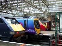 Mixed bag at Glasgow Central on 23 January featuring 91132 of NXEC, 185105 of First TransPennine Express, 221111 of Virgin West Coast and 156500 of First ScotRail.<br><br>[Graham Morgan 23/01/2008]
