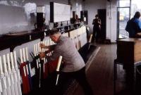 A signalman hard at work in the long departed Buckingham Junction signal box, to the west of the current Dundee station. (Photograph taken in 1980 during an Aberdeen University Railway Society trip to Dundee MPD).<br><br>
(Update - The grey jacketed signalman is Mr Charles Dand.)<br><br>[John Williamson //1980]