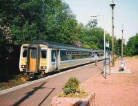 Morning train for Mallaig makes a stop at Helensburgh Upper in June 1998.<br><br>[David Panton /06/1998]