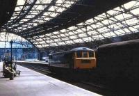 Lime Street station, Liverpool on 19 May 1970, with a class 86 locomotive standing idle between turns.<br><br>[John McIntyre 19/05/1970]