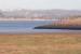 Part of the 440 yard long sea embankment that formed the southern approach to the Solway Viaduct, seen in November 2007, with the last of the cast iron piers still standing. On the north shore is the decommissioned Chapelcross nuclear power station. Although the cooling towers were demolished earlier in 2007 the four Magnox reactor halls still stand. The last train crossed the Solway Viaduct in August 1921 and it was finally demolished by Arnott Young & Co of Glasgow in 1934/5.<br><br>[John Furnevel 06/11/2007]