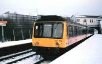 107 436 stands at Crossmyloof with an East Kilbride service on a snowy December morning in 1985.<br><br>[David Panton /12/1985]