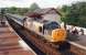 The 1430 Inverness - Edinburgh Waverley, hauled by 37140, photographed at Inverkeithing in June 1994.<br><br>[David Panton /06/1994]