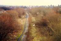 This was the view looking east over the disused Glasgow Central Railway platforms at Carmyle station in 1988. The platforms are now buried under the embankment of the M74 extension into Glasgow. The Rutherglen and Coatbridge platforms were further to the right. Today that is the location of the new(ish) station.<br><br>[Ewan Crawford //1988]