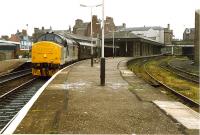 A 37 takes the Royal Scotsman north, at speed, through the curve of Arbroath station. The platform to the right was for locals to Forfar.<br><br>[Ewan Crawford //1989]