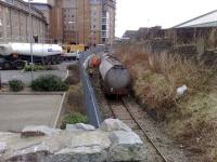 EWS staff at the scene of a tanker derailment on the Aberdeen Waterloo branch on 28 February 2008. Photograph shows the contents of one of the tanks in the process of being transferrred to a nearby ASCO road vehicle.  <br><br>[Stan Scott 28/02/2008]