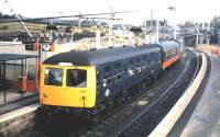 A <i>Tricoleur</i> DMU off the Largs branch stands at Kilwinning in August 1986, just prior to the commencement of electric services on the branch.<br><br>[David Panton /08/1986]