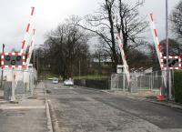 Looking north towards the A907 past the newly installed automatic barriers at Cambus level crossing on 28 February 2008.<br><br>[John Furnevel 28/02/2008]