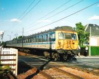305 506 with the daily North Berwick - Kirknewton service on Kingsknowe level crossing in July 1999. <br><br>[David Panton /07/1999]