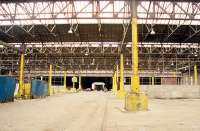 Interior of Guild Street Goods shed, east side, at the time given over for use as a carpark with a small portion at the south still in use for dry goods. This massive building has since been demolished. View looks north.<br><br>[Ewan Crawford /08/1999]