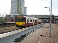 318 267 at Cardonald on 8 March on a service to Glasgow Central.<br><br>[David Panton 08/03/2008]