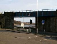 Looking southeast towards the Forth from Main Street, Torryburn, on 21 March through the bridge carrying the Longannet - Dunfermline line. Entrance to the former station (now mainly occupied by housing) is off to the left.   <br><br>[Craig Seath 21/03/2008]