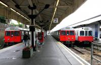 District Line trains occupying platforms 1,2 and 3 at Wimbledon terminus on 3rd July 2004.<br><br>[John Furnevel 03/07/2004]