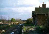 The remains of Drayton station on the Midland & Great Northern Joint line from Norwich City to Melton Constable in 1977. Closed to passengers in 1959, the station saw its last train in 1969 and was finally demolished in 1979. There was nothing left to harm in 1989....<br><br>[Mark Dufton /03/1977]