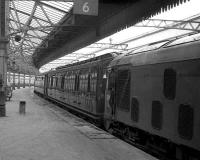 Empty stock of the Royal Train stands at Aberdeen platform 6 in May 1973 as the driver of the class 24 keeps an eye on proceedings.<br><br>[John McIntyre 26/05/1973]