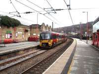 The Network Rail platforms at Keighley looking east on 1 April as 333015 departs on a Skipton - Leeds service. <br><br>[Mark Bartlett 01/04/2008]