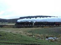 45407 and 60009 are seen north of Moy on the last stretch of single line before Inverness.<br><br>[John Gray 13/04/2008]