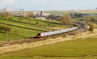 A northbound Pendolino leaving Shap with the the town and Hardendale Quarry as a backdrop.<br><br>[Ewan Crawford 14/04/2008]