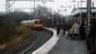 A Glasgow bound service enters Alexandria and a number of passengers walk purposefully along the platform on New Years Eve 2007. A short portion of the old disused northbound platform remains on the bridge.<br><br>[Ewan Crawford 31/12/2007]