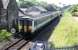 Newcastle bound Sprinter approaching the level crossing at the closed Kilkerran station. View from the signalbox. The loop is behind the camera on the other side of the level crossing just along from the box.<br><br>[Ewan Crawford //1989]