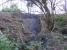 This seemingly small landside has closed the West Highland Line at Shandon.  View from old military line to Faslane Port on 2 March where tree cutting is taking place to allow plant access to the slip.<br><br>[John Robin 02/03/2008]