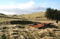 View west at Stobs on 6 February 2008 over part of the site of the former Stobs Camp (1903-1959). The various remains dotted around the hillsides say little of the many thousands of men who passed through here over the years, including those on their way to fight in two world wars. In addition, Stobs also operated for a time as a PoW Camp.  The area was rail served by a branch leaving the Waverley Line near Acreknowe Farm, north of Stobs Viaduct and, while few details are known due to the site being a militarily sensitive area for much of its life, Butts Directory lists a <I>private station</I> at Stobs Camp, although no opening or closing dates are given.<br><br>[John Furnevel 06/02/2008]