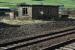 Last remaining building at the closed Beattock station. It is on the former island platform. The cut back northbound platform is just a mound. The freight bypass down the other side of the platform remains in place as a loop often used to move heavy freight trains out of the way of passenger trains before ascending Beattock Bank.<br><br>[Ewan Crawford 30/03/2008]