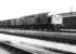 A southbound freight hauled by EE Type 4 D351 runs past the former steam shed at Carlisle Kingmoor in April 1971. <br><br>[John Furnevel 02/04/1971]