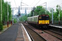 Westbound service entering Paisley St James. The junction for Glasgow Airport will be behind the train, just shy of the current station with the line running off to the left.<br><br>[Ewan Crawford 10/05/2008]