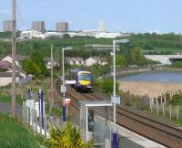 The 1351 Dundee to Glasgow Turbostar about to pass through Invergowrie. In the background are the high flats and hospital at Ninewells.<br><br>[Brian Forbes 14/05/2008]