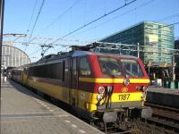 Belgian Railways electric loco number 1187 gets ready to depart Amsterdam with the 18.56 service to Brussels service on a sunny Sunday evening.<br><br>[Michael Gibb 18/05/2008]