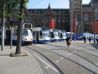 Ready, steady go! A line up of trams wait departure outside Amsterdam Central station.<br><br>[Michael Gibb 21/05/2008]