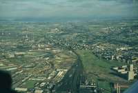 View of Polmadie shed looking to Rutherglen from the air.  The M74 extension will shadow the main line on the north side.<br><br>[John Robin 23/08/1969]