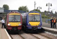 Delayed southbound trains stand at Stirling on 23 May following signalling problems at Larbert. On the left is an Alloa - Glasgow Queen Street service.<br><br>[Bill Roberton 23/05/2008]