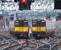 Probably not as close as it looks..? 314207 and 314211 outside Glasgow Central on 3rd April<br><br>[Graham Morgan 03/04/2008]